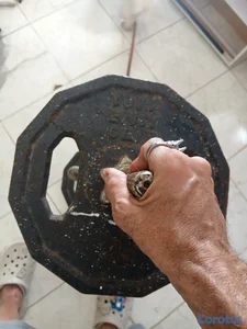 Pesa multi uso y discos 25 lbs y barra 10lbs
