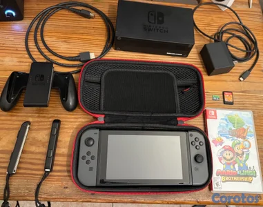 Nintendo Switch (V2) Todos accesorios y 2 juegos. 