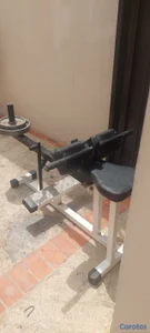 vendo maquina de pantorrillas sentado mas 70 libras en discos.