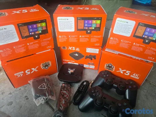 consolas y videojuegos - Tv box mas juegos 3 controles inalambricos 2 de juego y 1 para el tv box 5
